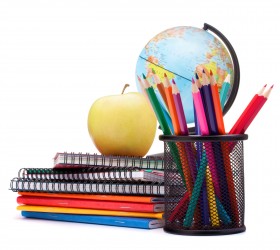 Globe, notebook stack and pencils. Schoolchild and student studies accessories. Back to school concept.